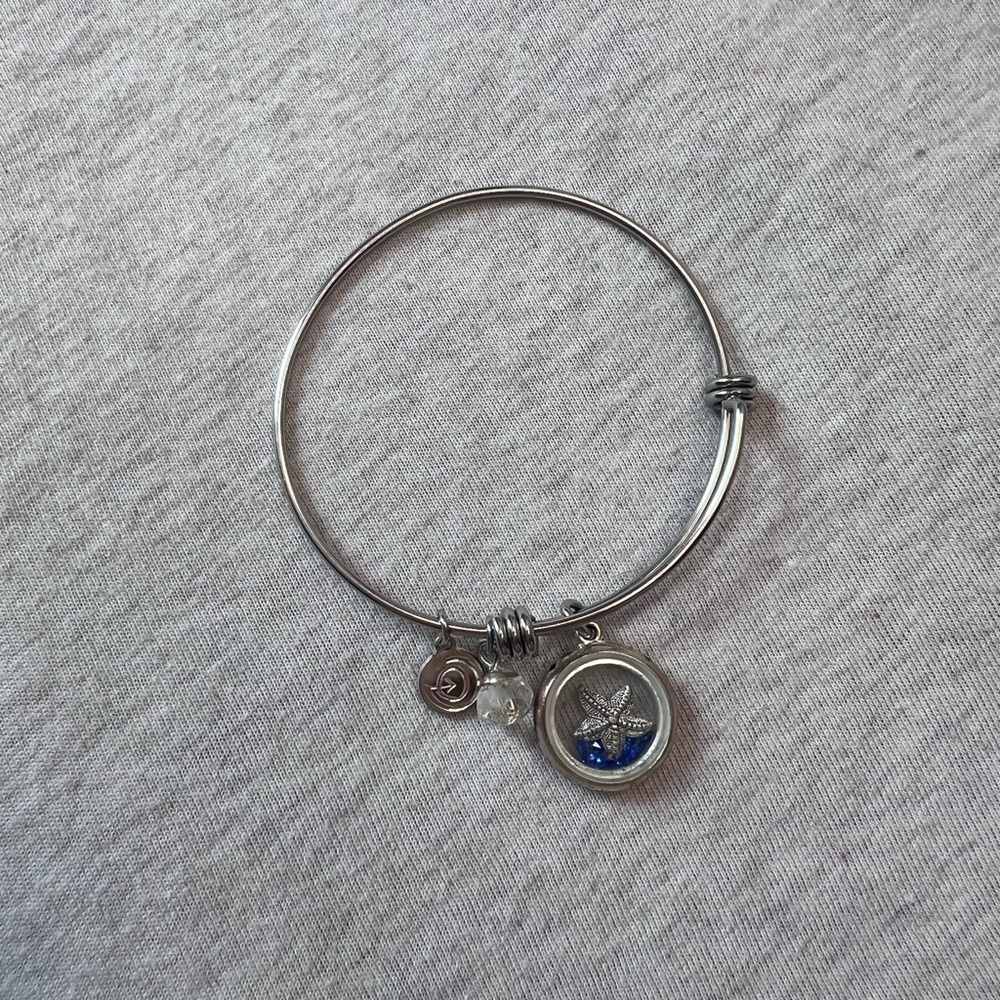 Silver and Blue Charm Bracelet with Delicate Design